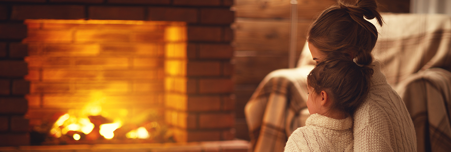 family enjoying stone fireplace in Shoreline townhome