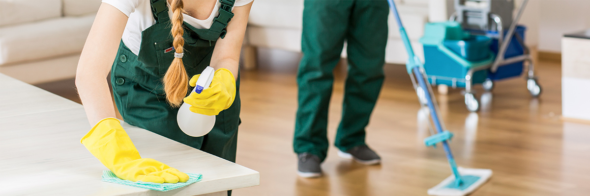 man and woman cleaning townhome