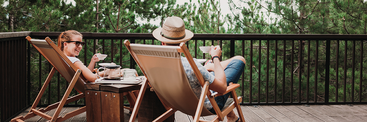 man and woman on patio discussing green technology in construction