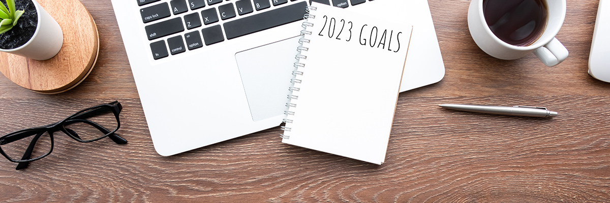 Notebook next to laptop