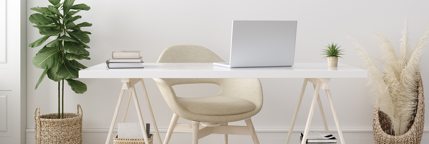 Home office desk with white laptop