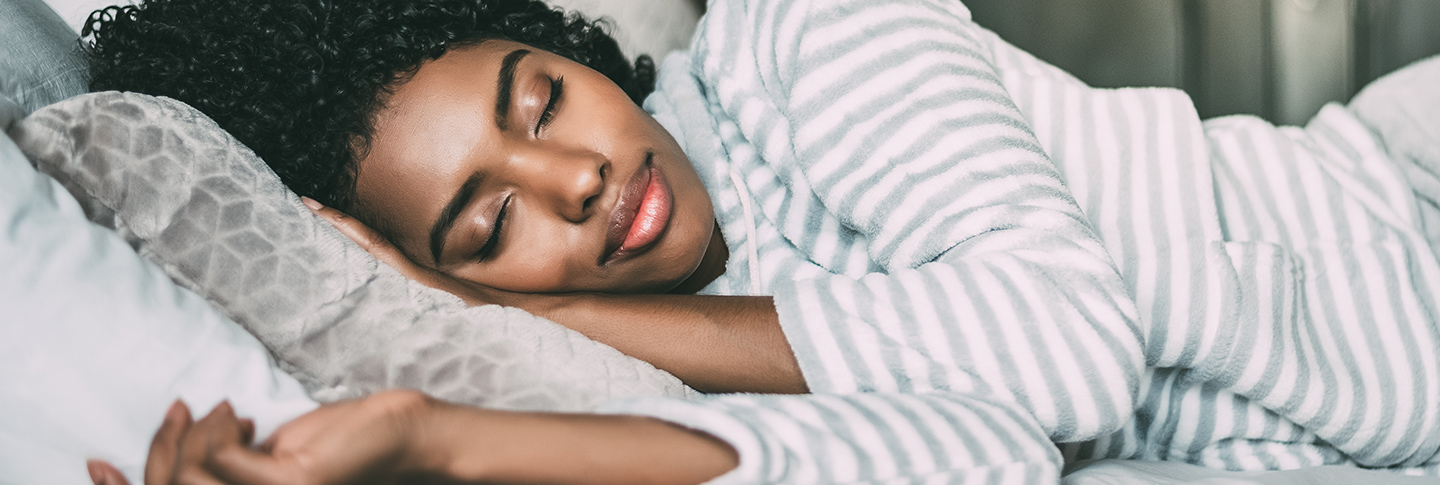 Woman sleeping on bed